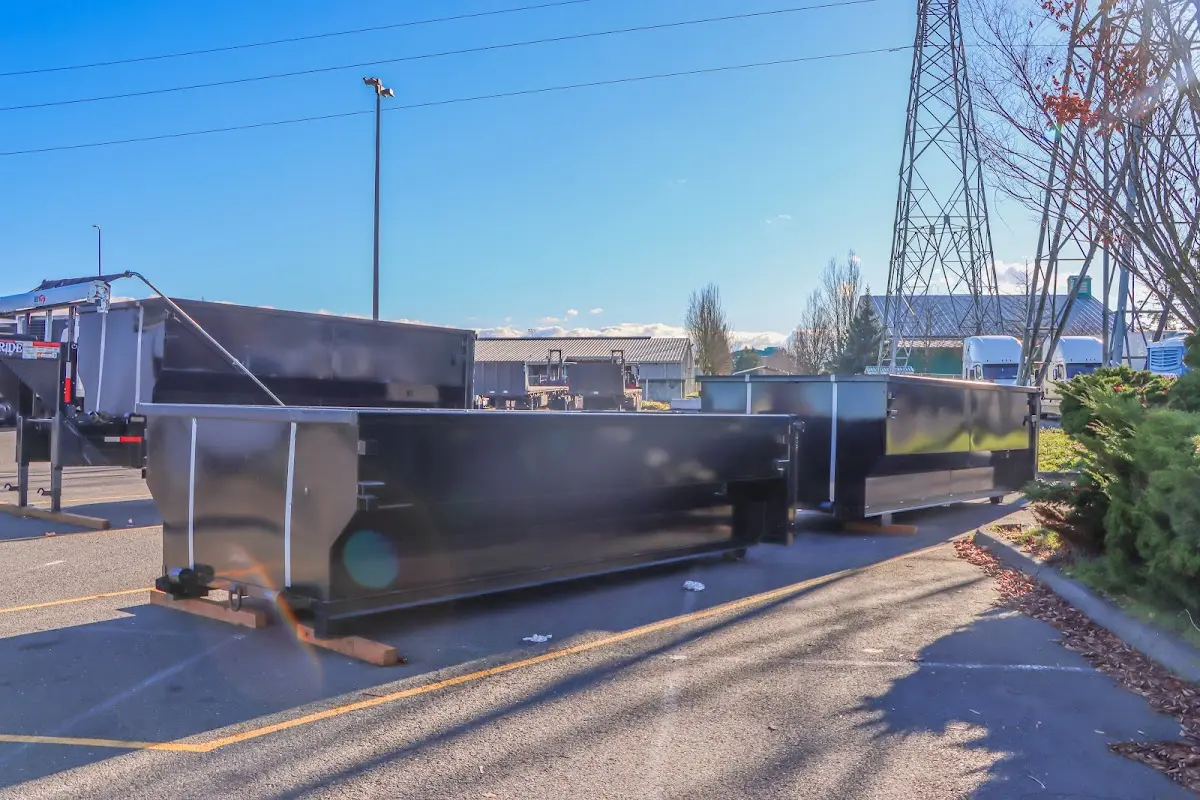 Roll-off dumpster ready for waste disposal at job site for 2 Yard Dumpster Rental in New Gloucester